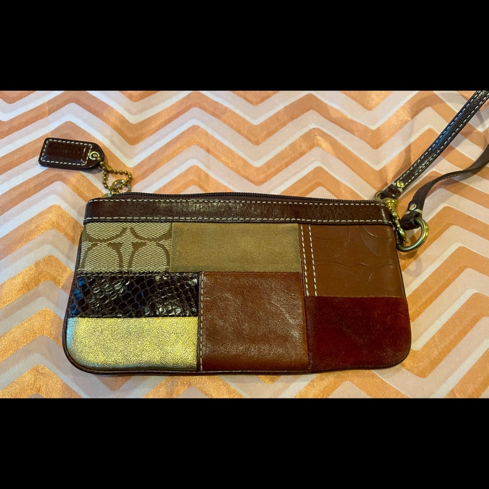 Coach wristlet burgundy, brown gold leather